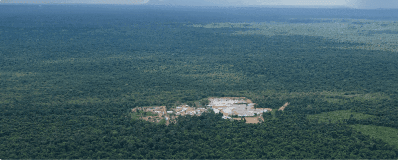 The expanding mining site belonging to KP Cement opens a brown hole in the green canopy of Prey Lang’s forest. Image by Gerald Flynn / Mongabay.